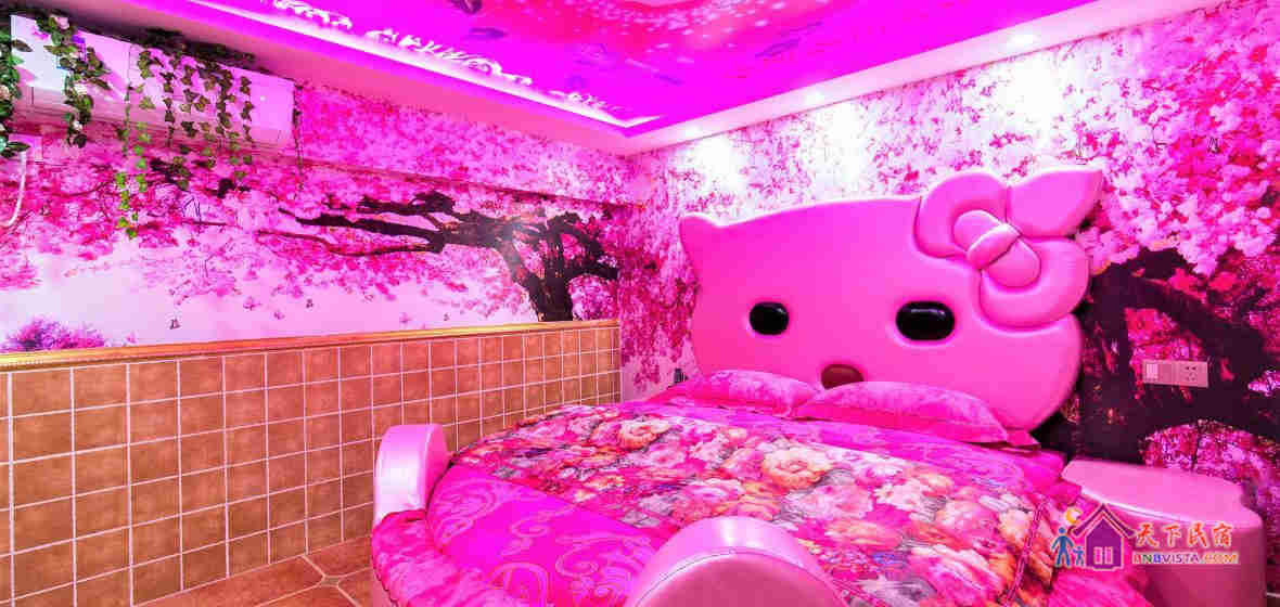粉色情缘圆床房